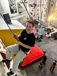 All smiles as a climber descends after conquering the red volumes!